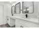 Bright bathroom with dual sinks, sleek fixtures, and modern mirrors for a spa-like experience at 7230 N 70Th Ln, Glendale, AZ 85303