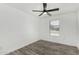 Bedroom with hardwood flooring, ceiling fan, and window at 7230 N 70Th Ln, Glendale, AZ 85303