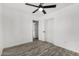Bright bedroom featuring wood-look floors, a ceiling fan, and a closet at 7230 N 70Th Ln, Glendale, AZ 85303