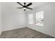 Bedroom with wood-look floors filled with natural light from a window, enhancing the peaceful ambiance at 7230 N 70Th Ln, Glendale, AZ 85303