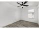 Bedroom has wood-look floors and is filled with natural light from a window with neighborhood views at 7230 N 70Th Ln, Glendale, AZ 85303