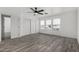 Bedroom featuring hardwood flooring, large windows, and closet at 7230 N 70Th Ln, Glendale, AZ 85303