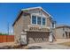 Two-story house featuring a two-car garage, and a simple yard with desert landscaping at 7230 N 70Th Ln, Glendale, AZ 85303