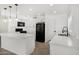 Open-concept kitchen features white cabinets, quartz countertops, and ample space at 7230 N 70Th Ln, Glendale, AZ 85303