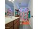 Bright bathroom featuring a vanity with storage and a shower with a colorful shower curtain at 737 W Desert Valley Dr, San Tan Valley, AZ 85143