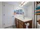 Bathroom with a well-lit vanity, providing ample space for personal care and storage at 737 W Desert Valley Dr, San Tan Valley, AZ 85143