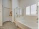 Bright bathroom with a large tub and separate glass shower at 737 W Desert Valley Dr, San Tan Valley, AZ 85143