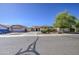 Charming single-story home with a well-manicured front yard, desert landscaping, and a three car garage at 737 W Desert Valley Dr, San Tan Valley, AZ 85143