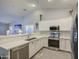 Lovely kitchen with granite countertops and stainless steel appliances at 737 W Desert Valley Dr, San Tan Valley, AZ 85143