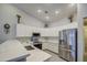 Well-lit kitchen equipped with modern stainless steel appliances and marble countertop at 737 W Desert Valley Dr, San Tan Valley, AZ 85143