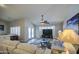 Comfortable living room space with a ceiling fan and outdoor access at 737 W Desert Valley Dr, San Tan Valley, AZ 85143