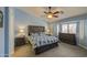 Spacious main bedroom featuring a large bed, ceiling fan, and ample natural light at 737 W Desert Valley Dr, San Tan Valley, AZ 85143