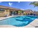 Relaxing backyard pool with lounge chairs and covered patio seating area perfect for entertaining at 737 W Desert Valley Dr, San Tan Valley, AZ 85143
