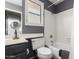 Clean bathroom featuring a shower-tub, vanity, and a shuttered window at 7402 W Kerry Way, Glendale, AZ 85308