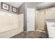 A clean bathroom features tile flooring, a shower, and a soaking tub at 7402 W Kerry Way, Glendale, AZ 85308