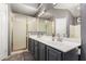 Bathroom featuring a double vanity, shower, and modern finishes at 7402 W Kerry Way, Glendale, AZ 85308