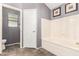 A clean bathroom featuring tile flooring, a shower, and a soaking tub at 7402 W Kerry Way, Glendale, AZ 85308