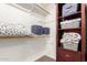 Organized walk-in closet with shelves, hanging rods, and ample storage at 7402 W Kerry Way, Glendale, AZ 85308
