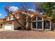 Charming two-story home featuring a tile roof, two-car garage, and desert landscaping at 7402 W Kerry Way, Glendale, AZ 85308