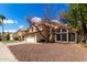 Charming two-story home featuring a tile roof, two-car garage, and desert landscaping at 7402 W Kerry Way, Glendale, AZ 85308