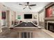 A game room with light wood paneled wall, a flat screen tv and a billiard table at 7402 W Kerry Way, Glendale, AZ 85308