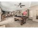A game room with a pool table, kitchenette and access to different areas of the home at 7402 W Kerry Way, Glendale, AZ 85308