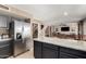 Open concept kitchen with stainless steel appliances, granite countertops, and easy access to other living spaces at 7402 W Kerry Way, Glendale, AZ 85308