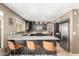 Open kitchen with stainless steel appliances, granite countertops, a breakfast bar, and lots of natural light at 7402 W Kerry Way, Glendale, AZ 85308