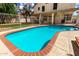Sparkling swimming pool, with a secured fence, nestled in a spacious backyard with green lawn, offering the ultimate retreat at 7402 W Kerry Way, Glendale, AZ 85308