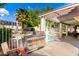 Outdoor kitchen with stainless steel BBQ grill and a sparkling swimming pool and a spa in a backyard oasis at 7402 W Kerry Way, Glendale, AZ 85308