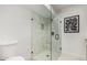 Modern walk-in shower with tile, glass door and decorative accents at 7467 E Pleasant Run, Scottsdale, AZ 85258
