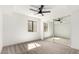 Bright bedroom with a large window, mirrored closet, and neutral carpet at 7467 E Pleasant Run, Scottsdale, AZ 85258