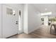 Bright and modern foyer with clean lines, wood floors, and a stylish front door with sidelight at 7467 E Pleasant Run, Scottsdale, AZ 85258