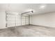 This garage features a white door and concrete flooring, ready for your projects at 7467 E Pleasant Run, Scottsdale, AZ 85258