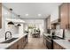 Contemporary kitchen with stainless appliances, quartz countertops and open layout to living spaces at 7467 E Pleasant Run, Scottsdale, AZ 85258
