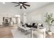 Open-concept living room with stylish furnishings and a view of the dining area and kitchen at 7467 E Pleasant Run, Scottsdale, AZ 85258