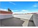 Spacious outdoor balcony with a stucco privacy wall and views of the surrounding neighborhood at 7826 N 21St Ln, Phoenix, AZ 85021