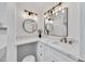 Bright bathroom features a stylish sink and vanity with modern fixtures and elegant mirrors at 7826 N 21St Ln, Phoenix, AZ 85021