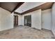 Spacious tiled front courtyard with a decorative front door and large sliding glass windows at 7826 N 21St Ln, Phoenix, AZ 85021