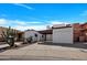 Charming single-Gathering home boasting desert landscaping, a covered carport, and a single-car garage at 7826 N 21St Ln, Phoenix, AZ 85021