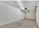 Spacious garage with concrete flooring, overhead lighting, and an automatic door opener at 7826 N 21St Ln, Phoenix, AZ 85021