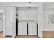 A compact laundry closet with a stacked washer and dryer, maximizing space and convenience at 7826 N 21St Ln, Phoenix, AZ 85021