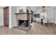 Bright and airy living space featuring a brick fireplace and an adjacent dining area at 7826 N 21St Ln, Phoenix, AZ 85021
