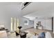 Spacious living room featuring a vaulted ceiling, wood floors, and modern lighting at 7826 N 21St Ln, Phoenix, AZ 85021