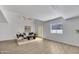 Bright living room featuring a vaulted ceiling, wood floors, and neutral decor at 7826 N 21St Ln, Phoenix, AZ 85021