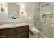 Bathroom with a glass shower, wood vanity, and decorative mirror at 7979 E Princess Dr # 26, Scottsdale, AZ 85255