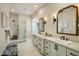 Modern bathroom with dual vanities, stylish mirrors, and glass-enclosed shower at 7979 E Princess Dr # 26, Scottsdale, AZ 85255