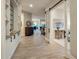 Inviting hallway showcasing hardwood floors, custom built-ins, and an open floor plan at 7979 E Princess Dr # 26, Scottsdale, AZ 85255