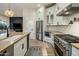 Modern kitchen with stainless steel appliances, a gas range, and bright cabinetry at 7979 E Princess Dr # 26, Scottsdale, AZ 85255