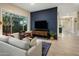 Stylish living room featuring modern decor, a large window, and an open layout at 7979 E Princess Dr # 26, Scottsdale, AZ 85255